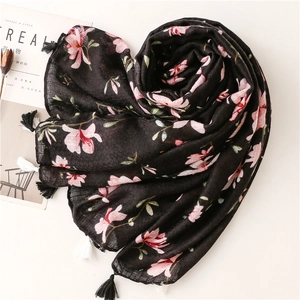 Elegant black cotton linen scarf with pink magnolia flower print and tassel trim decor