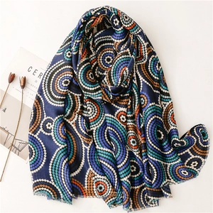 Vintage navy scarf with orange kaleidoscope circle patterns and fringe edge detailing