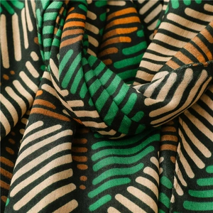 Close-up of striped cotton-linen scarf showing the premium woven texture and geometric pattern