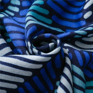 Detailed close-up of blue and gray striped textile fabric showing woven fiber texture