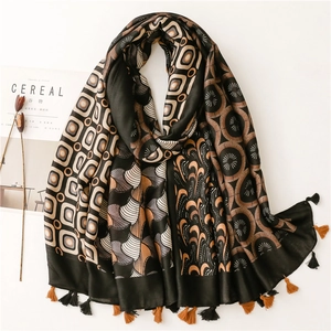 Artistic geometric print scarf with contrast fringe on a minimalist background