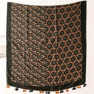 Detail of vintage paisley cotton-blend shawl with tassel fringe and geometric patterns