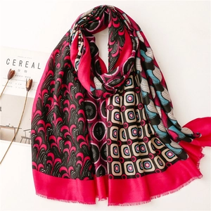 Detail of soft rectangular pashmina with intricate geometric patterns and fringe edges