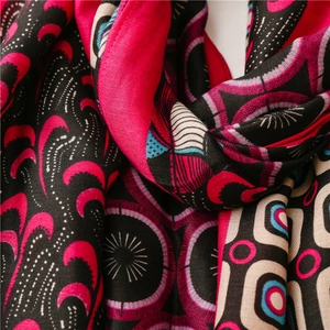 Detailed macro view of paisley pattern cotton-linen scarf with ethnic geometric prints