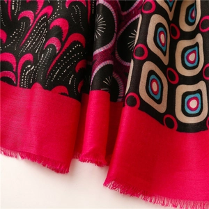 Close-up of exotic cashew pattern cotton scarf with bohemian print and fringe detail