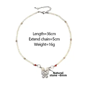 Detail of beaded butterfly necklace with natural stones, 36cm length and 5cm extension