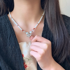 Elegant butterfly pendant necklace with sparkling zircons and white faceted beads for women