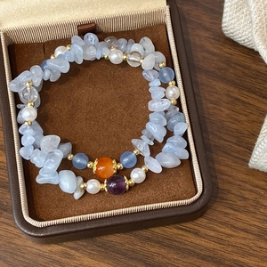 Handmade beaded bracelet with turquoise natural stones and pearls in a velvet jewelry box