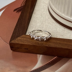 Silver bow ribbon open ring featuring a minimalist adjustable design for women