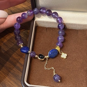 Handmade amethyst bead bracelet with four-leaf clover pendant and lapis lazuli stones