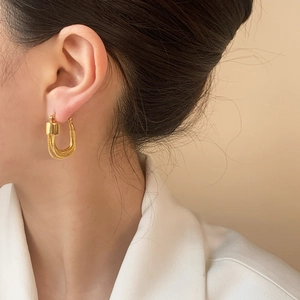 Elegant gold U-shaped tiered chain drop earrings for a sophisticated minimalist look