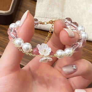 Handmade beaded bracelet with white shell flowers, purple crystals and pearls for women