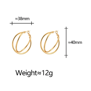 Detail view of 18k gold plated double hoop earrings with 38mm width and 40mm height size