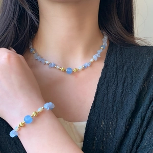 Elegant natural pearl and light blue irregular stone necklace set with golden beads