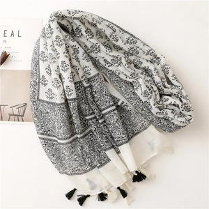 Floral print cotton linen feel scarf with bohemian tassels for a fresh feminine look