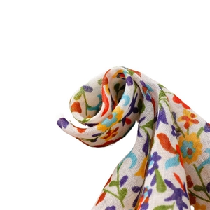 Soft cotton-linen floral scarf with colorful small patterns and fringe details
