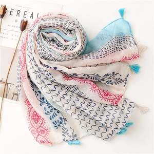 Elegant floral cotton linen scarf with blue and pink print and decorative tassels
