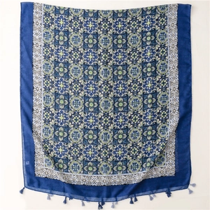 Detail of blue mandala print scarf with intricate patterns and soft tassels