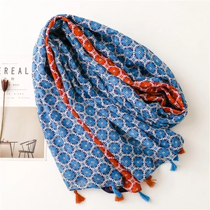 Bohemian blue printed scarf with ethnic geometric patterns and colorful tassels