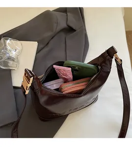 Deep brown glossy PU leather hobo bag showing large capacity for phone and wallet