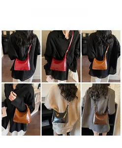 Detailed views of vintage pillow bag with glossy finish and logo embossing on shoulder strap