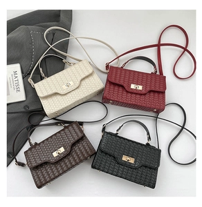 Detailed flat lay of woven texture handbags in cream, burgundy, dark brown and black colors