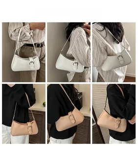 French style underarm baguette bag shown on model in beige and khaki colors