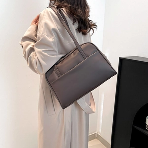 Minimalist taupe matte leather shoulder bag with large front pocket for office commute