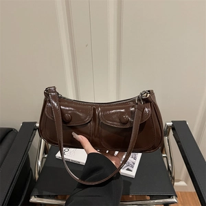 Retro dark brown patent leather underarm bag with dual front pockets and glossy finish