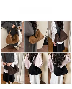 Detail of vintage suede hobo bag in brown, coffee and black with wide shoulder straps