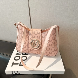 Pink faux leather shoulder bag with embossed M-pattern and gold metal M-clasp logo