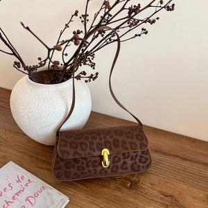Vintage brown leopard print underarm bag with gold oval clasp and slim shoulder strap
