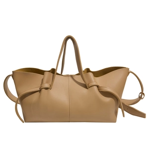 Minimalist khaki leather tote bag with pleated detail and adjustable shoulder strap