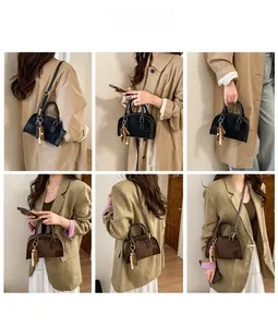 Borsa Boston retrò in pelle opaca nera e marrone mostrata in vari stili di trasporto