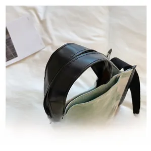 Detail of the high-quality leather handles and green marble print fabric on this tote bag