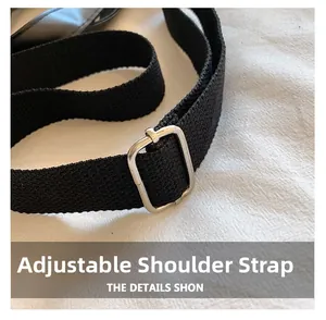 Detail of adjustable black fabric shoulder strap with premium silver metal buckle hardware