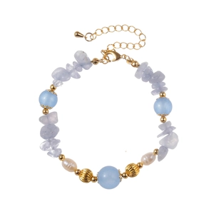 Elegant beaded bracelet with blue stones, baroque pearls, and gold-plated metal accents