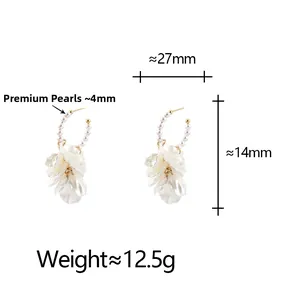 Detail view of pearl hoop earrings with white petals and dimensions labeled