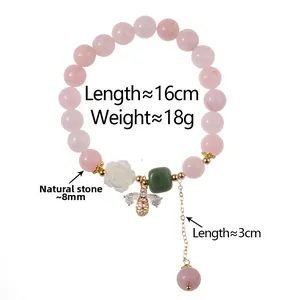 Detail of pink strawberry quartz bracelet with rose, bee pendant and size specifications