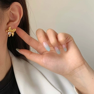 Vintage gold flower stud earring with irregular petals and a zircon water drop pendant