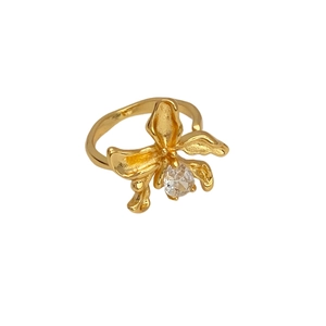 Macro shot of gold-plated irregular flower ring featuring a sparkling zircon center stone