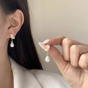 Elegant gold pearl drop earrings with cat eye stone in butterfly leaf design for women
