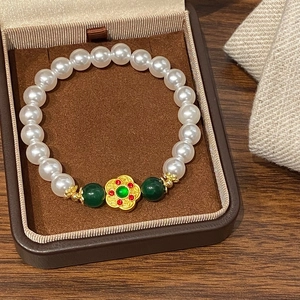 Handmade beaded bracelet with pearls, green carnelian and golden flower charm in a gift box