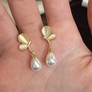 Elegant gold butterfly earrings with cat-eye wings and water-drop pearl pendants