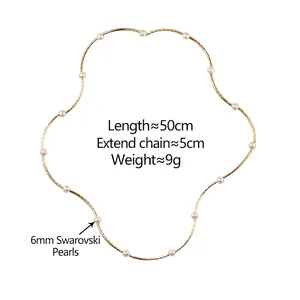 Elegant gold chain necklace featuring 14 white 6mm pearls in a floral layout