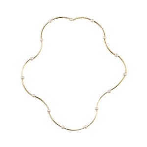 Elegant gold wavy necklace featuring minimalist white pearls on a sleek metal chain
