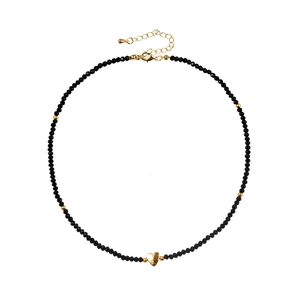 Minimalist black beaded necklace featuring a polished gold heart pendant and adjustable clasp