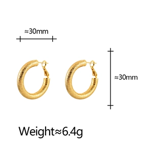Gold-plated matte textured hoop earrings with 30mm diameter and minimalist geometry