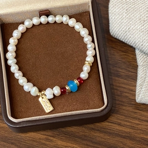 Elegant Chinese style freshwater pearl bracelet with red carnelian and gold charm in gift box