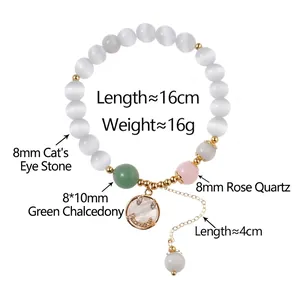 Natural white cat-eye stone beaded bracelet with golden smiley face pendant and green stone